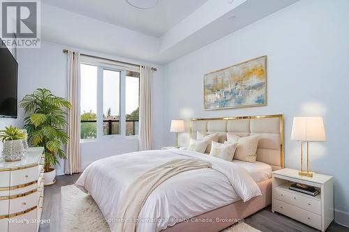 virtually staged Primary Bedroom with ensuite - 301 - 1 Hume Street, Collingwood, ON - Indoor Photo Showing Bedroom