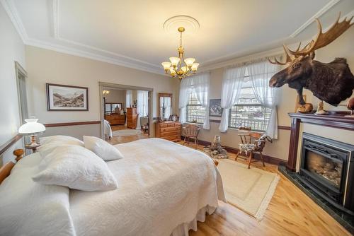 120 Wattsville Road, Cranbrook, BC - Indoor Photo Showing Bedroom With Fireplace