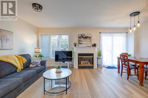 59 Bar Harbour Square, Toronto, ON - Indoor Photo Showing Living Room With Fireplace