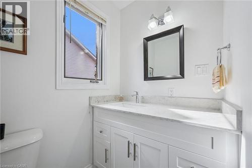 Half bath featuring toilet and vanity - 599 Beechwood Drive, Waterloo, ON - Indoor Photo Showing Bathroom