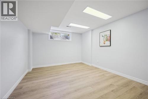 Spare room with light wood-style flooring and baseboards - 599 Beechwood Drive, Waterloo, ON - Indoor