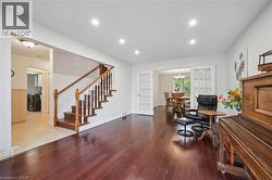 Office space with wood finished floors, recessed lighting, and a chandelier - 