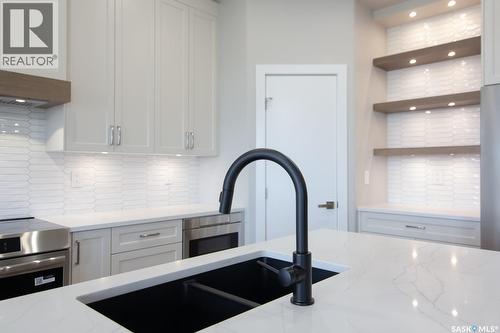 423 Sharma Crescent, Saskatoon, SK - Indoor Photo Showing Kitchen With Double Sink With Upgraded Kitchen