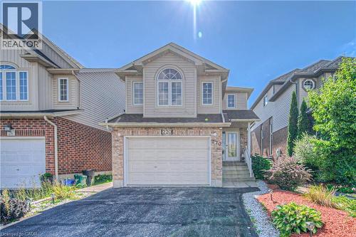 View of front facade with an attached garage and driveway - 220 Sienna Crescent, Kitchener, ON - Outdoor