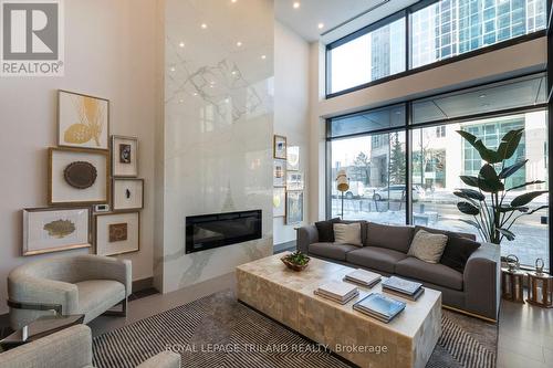 Front Lobby - 2308 - 505 Talbot Street, London East (East F), ON - Indoor Photo Showing Living Room With Fireplace