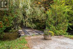 Small bridge crosses the creek to the property - 