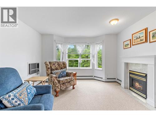 250 5 Street Se Unit# 314, Salmon Arm, BC - Indoor Photo Showing Living Room With Fireplace