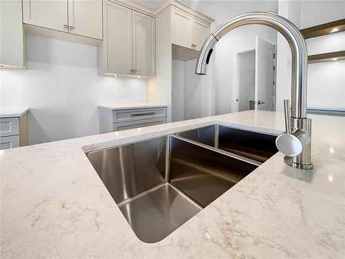 39 Fieldstone Crescent, Brandon, MB - Indoor Photo Showing Kitchen With Double Sink