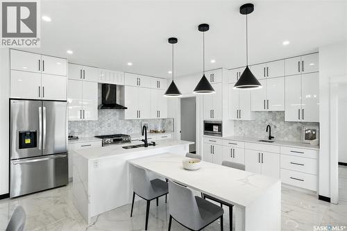 319 Woolf Bay, Saskatoon, SK - Indoor Photo Showing Kitchen With Stainless Steel Kitchen With Double Sink With Upgraded Kitchen
