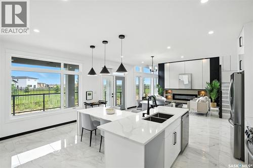 319 Woolf Bay, Saskatoon, SK - Indoor Photo Showing Kitchen With Stainless Steel Kitchen With Double Sink With Upgraded Kitchen
