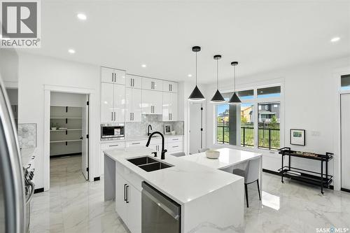 319 Woolf Bay, Saskatoon, SK - Indoor Photo Showing Kitchen With Stainless Steel Kitchen With Double Sink With Upgraded Kitchen