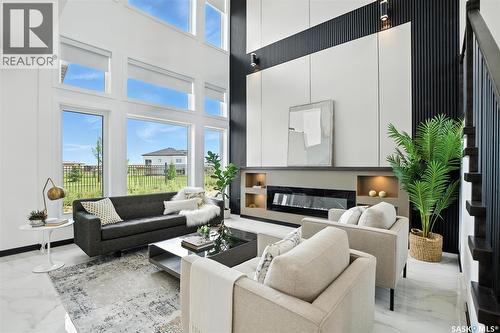 319 Woolf Bay, Saskatoon, SK - Indoor Photo Showing Living Room With Fireplace