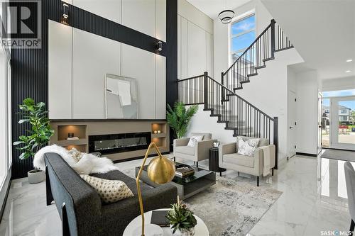 319 Woolf Bay, Saskatoon, SK - Indoor With Fireplace