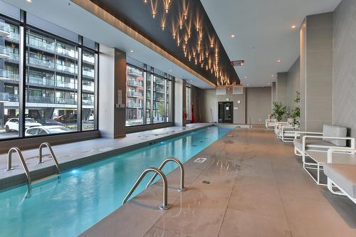 Piscine - 714-700 Rue Des Éclaircies, Brossard, QC - Indoor Photo Showing Other Room With In Ground Pool