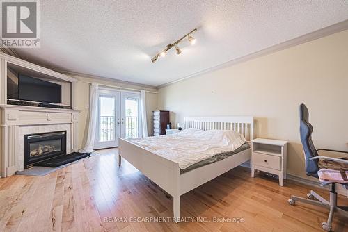 6 - 85 Edgewater Drive, Hamilton, ON - Indoor Photo Showing Bedroom With Fireplace