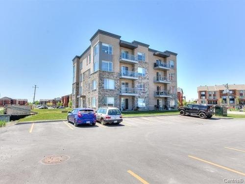 Stationnement - 206-7085 Rue De Lunan, Brossard, QC - Outdoor With Balcony With Facade
