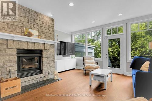 Family Room with Wood Burning Fireplace - 23 Davidson Drive, Ottawa, ON - Indoor Photo Showing Living Room With Fireplace
