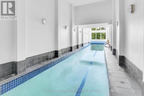 Virtually Stagged Water in 70ft Pool - 23 Davidson Drive, Ottawa, ON - Indoor Photo Showing Other Room With In Ground Pool