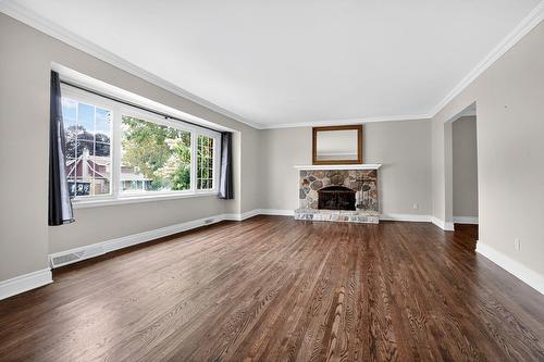 Living room - 12 Place Redfern, Beaconsfield, QC - Indoor Photo Showing Living Room With Fireplace