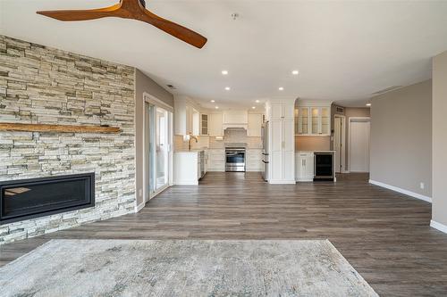 300-6805 Cottonwood Drive, Osoyoos, BC - Indoor Photo Showing Living Room With Fireplace