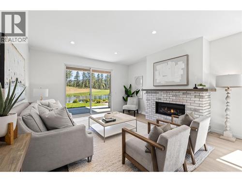 Photo of a similar home in the community. - 1979 Country Club Drive Unit# 6, Kelowna, BC - Indoor Photo Showing Living Room With Fireplace