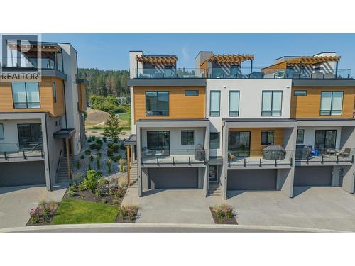 Welcome to 4-105 Predator Ridge Drive. Live full time or put it in rental pool! - 105 Predator Ridge Drive Unit# 4, Vernon, BC - Outdoor