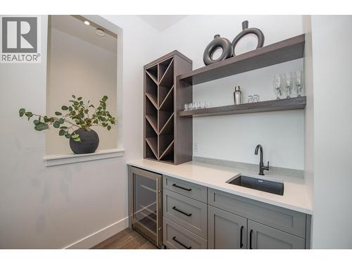 Bar area with wine fridge. - 105 Predator Ridge Drive Unit# 4, Vernon, BC - Indoor