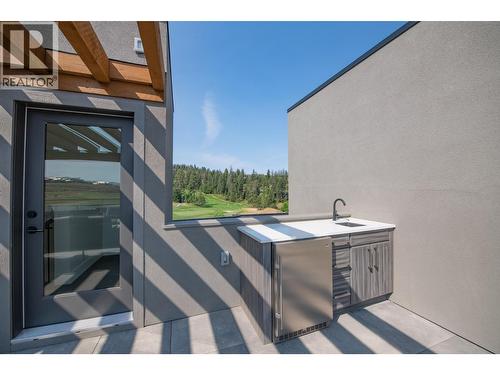Bar fridge and sink - 105 Predator Ridge Drive Unit# 4, Vernon, BC - Outdoor With Exterior