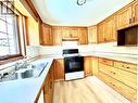 1118 Selo Place, Regina, SK  - Indoor Photo Showing Kitchen With Double Sink 