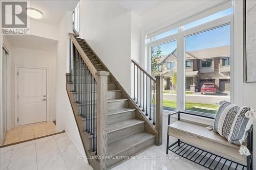 9 ft ceilings, porcelain tiles - 2180 Postmaster Drive, Oakville, ON - Indoor Photo Showing Other Room