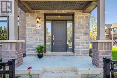 Charming curb appeal with stone and stucco - 2180 Postmaster Drive, Oakville, ON - Outdoor With Deck Patio Veranda
