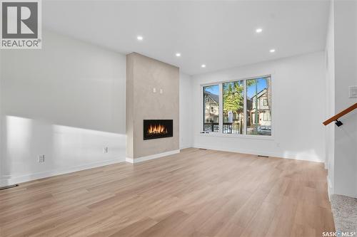 819 6Th Avenue N, Saskatoon, SK - Indoor Photo Showing Other Room With Fireplace