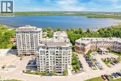 Bird's eye view of the lake and apartment complex - 