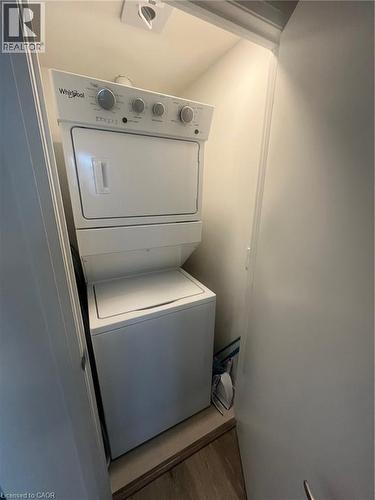Stacked washer / dryer - 58 Lakeside Terrace Unit# 201, Barrie, ON - Indoor Photo Showing Laundry Room