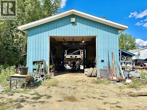 Rear of shop, drive-thru 12 by 12 bay doors allow for easy access of vehicles to and from the shop to the side bay door of the main building - 4751 5Th Avenue Sw, Salmon Arm, BC 