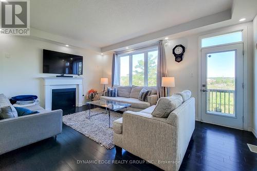 84 Longboat Run W, Brantford, ON - Indoor Photo Showing Living Room With Fireplace