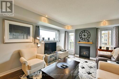 201 - 5 Anchorage Crescent, Collingwood, ON - Indoor Photo Showing Living Room With Fireplace