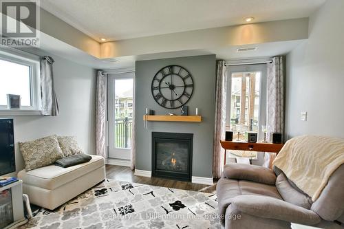 201 - 5 Anchorage Crescent, Collingwood, ON - Indoor Photo Showing Living Room With Fireplace