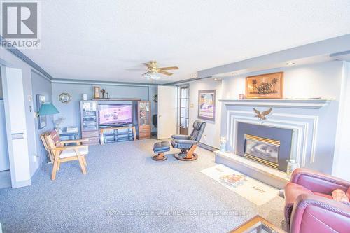 357 The Captains Corners, Kawartha Lakes (Bobcaygeon), ON - Indoor Photo Showing Living Room With Fireplace