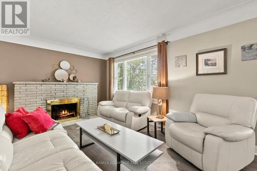 Wood burning fireplace. - 302 Main Street E, Grimsby (Grimsby East), ON - Indoor Photo Showing Living Room With Fireplace