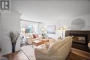 3 - 2058 Brant Street, Burlington, ON  - Indoor Photo Showing Living Room With Fireplace 