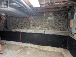 Original stone foundation under crawl space - 