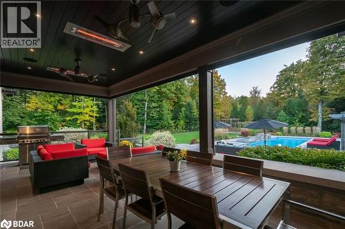 View of patio / terrace featuring an outdoor pool, ceiling fan, outdoor lounge area, outdoor dining space, and grilling area - 13160 Nassagaweya Esquesing Townline, Milton, ON - Outdoor With In Ground Pool With Deck Patio Veranda With Exterior