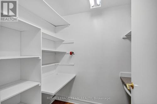 walk-in linen closet/small den with built-in desks - 1264 Morrison Drive, Ottawa, ON - Indoor With Storage