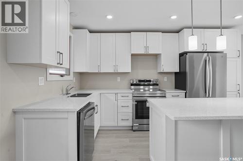 42 Aitken Crescent, Regina, SK - Indoor Photo Showing Kitchen With Stainless Steel Kitchen With Double Sink With Upgraded Kitchen