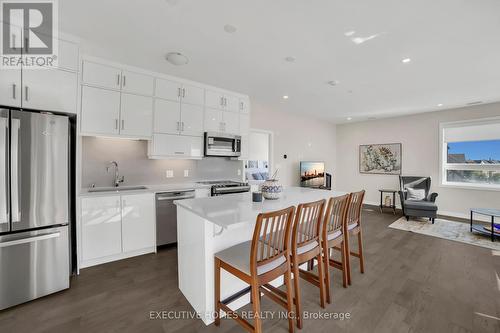 208 - 3265 Carding Mill Trail, Oakville, ON - Indoor Photo Showing Kitchen With Stainless Steel Kitchen With Upgraded Kitchen