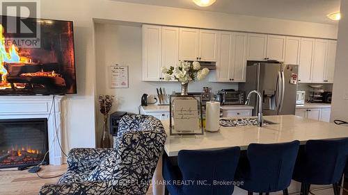 42 Lake Trail Way, Whitby, ON - Indoor Photo Showing Kitchen With Fireplace With Double Sink