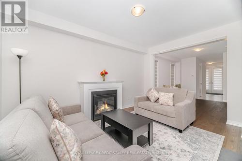 15 Weylie Street, Hamilton, ON - Indoor Photo Showing Living Room With Fireplace