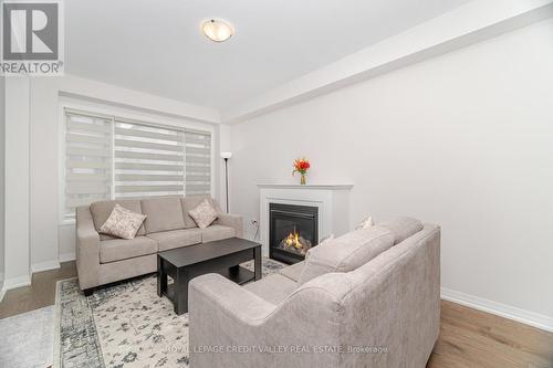 15 Weylie Street, Hamilton, ON - Indoor Photo Showing Living Room With Fireplace
