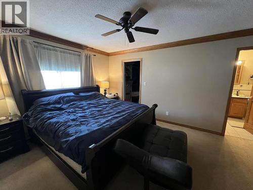 5551 Maxhamish Crescent, Fort Nelson, BC - Indoor Photo Showing Bedroom